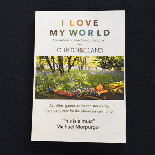 Book titled 'I Love My World' by Chris Holland on a dark background